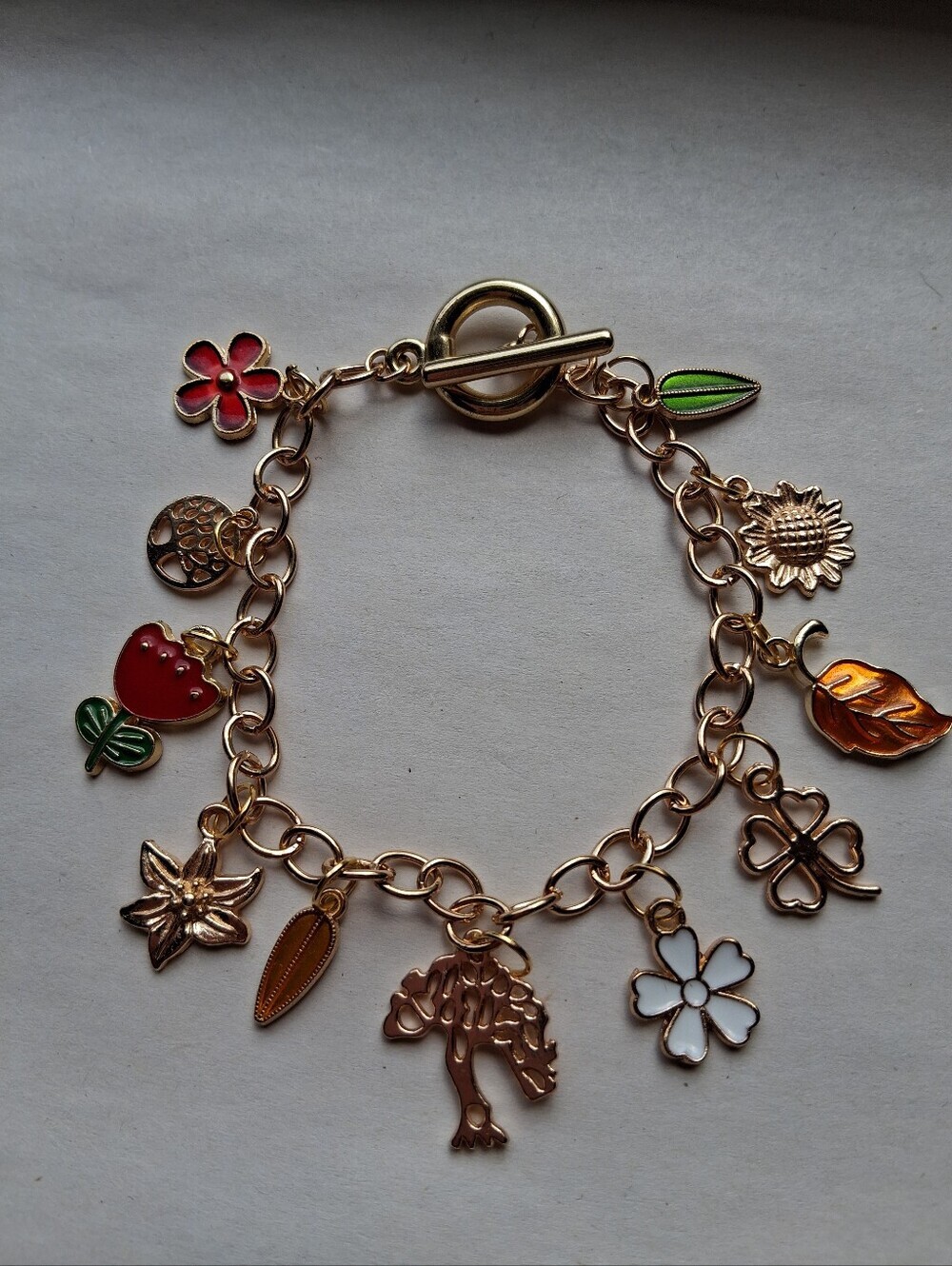 Hand Crafted Gold Charm Bracelet with Red, Green, White and Orange Accents